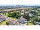 Scenic aerial view of a neighborhood with a city skyline, green landscape, and nearby highway at 2024 E Columbus Dr, Tampa, FL 33605