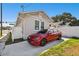 Charming home exterior with a red car parked in the driveway at 2024 E Columbus Dr, Tampa, FL 33605