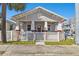 Charming bungalow with a white picket fence and inviting front porch at 2024 E Columbus Dr, Tampa, FL 33605