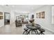 Open-concept living room with tile floors and neutral colored decor at 2024 E Columbus Dr, Tampa, FL 33605