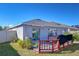 Backyard deck featuring an outdoor rug, a covered grill, partial fencing, and a grassy yard at 2112 Purple Orchid Pl, Ruskin, FL 33570