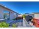 Backyard deck with an outdoor rug, a red railing, a covered grill, and partial fencing at 2112 Purple Orchid Pl, Ruskin, FL 33570