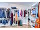 Walk-in closet with ample storage space and organized shelving for clothing and accessories at 2112 Purple Orchid Pl, Ruskin, FL 33570