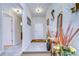 Bright hallway with decorative art and tile flooring, creating a welcoming entrance to the home at 2112 Purple Orchid Pl, Ruskin, FL 33570