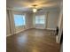 Living room with hardwood floors, neutral paint, and large windows at 2301 46Th S St, St Petersburg, FL 33711