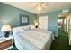 Cozy bedroom with a comfortable bed, ceiling fan, and access to the hallway at 2434 Australia E Way # 44, Clearwater, FL 33763