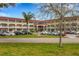 Spacious condominium complex with mature landscaping, ample parking, and well-maintained facade at 2434 Australia E Way # 44, Clearwater, FL 33763