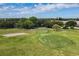 Aerial view of a pristine golf course featuring manicured greens and sand traps at 2434 Australia E Way # 44, Clearwater, FL 33763