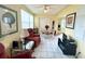 Cozy living room features bright tile floors, a ceiling fan, and natural lighting at 2434 Australia E Way # 44, Clearwater, FL 33763