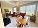 Cozy living room features bright tile floors, a ceiling fan, and natural lighting at 2434 Australia E Way # 44, Clearwater, FL 33763