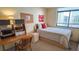 Cozy bedroom features a large window with a view and a dedicated desk space at 2612 Pearce Dr # 210, Clearwater, FL 33764