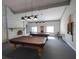 Community billiard room with two pool tables, exposed brick and natural lighting at 2612 Pearce Dr # 210, Clearwater, FL 33764