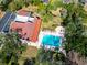 Overhead view of the community pool with lounge seating and mature trees at 2612 Pearce Dr # 210, Clearwater, FL 33764