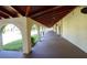 Open hallway with white arches and a terracotta tiled roof at 2612 Pearce Dr # 210, Clearwater, FL 33764