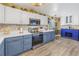 Well-lit kitchen featuring stainless steel appliances, range hood, and sleek countertops at 2885 18Th N Ave, St Petersburg, FL 33713