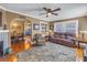 Warm living room featuring a cozy seating area with an open view into the dining room at 2885 18Th N Ave, St Petersburg, FL 33713