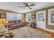 Cozy living room featuring hardwood floors, a plush sofa, and ample natural light at 2885 18Th N Ave, St Petersburg, FL 33713