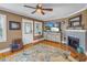 Comfortable living room featuring a fireplace, hardwood floors, and natural light at 2885 18Th N Ave, St Petersburg, FL 33713