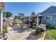 Cozy patio with an outdoor dining set, grill, well-manicured grass and garden at 2885 18Th N Ave, St Petersburg, FL 33713