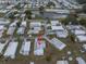 An aerial view of a neighborhood showcasing well-maintained homes and community features at 36806 Niles Dr, Zephyrhills, FL 33542