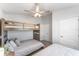 Bedroom featuring a bunk bed, natural lighting, carpet, and a ceiling fan at 38205 Countryside Pl, Dade City, FL 33525