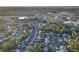 An aerial view of a residential community, showcasing proximity to shopping centers and parks at 4077 Ramona Dr, Spring Hill, FL 34606