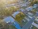 An aerial view of a residential neighborhood with mature trees and single-Gathering homes at 4077 Ramona Dr, Spring Hill, FL 34606