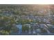 A scenic aerial shot of a suburban neighborhood, featuring tree-lined streets and tidy homes at 4077 Ramona Dr, Spring Hill, FL 34606