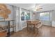 Cozy dining area with a wooden table and bench seating with plenty of natural light at 4077 Ramona Dr, Spring Hill, FL 34606