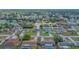 Panoramic aerial view of the residential neighborhood with tree-lined streets and well-kept homes at 4306 Goldcoast Ave, Spring Hill, FL 34609