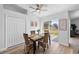 Cozy dining area with a modern table setting, sliding glass door, and ample natural light at 4306 Goldcoast Ave, Spring Hill, FL 34609