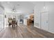 Inviting dining area featuring hardwood floors, natural light, and views of the outdoor area at 4306 Goldcoast Ave, Spring Hill, FL 34609