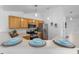 Well-lit kitchen featuring stainless steel appliances, light wood cabinetry, and a breakfast bar at 4306 Goldcoast Ave, Spring Hill, FL 34609