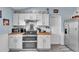 Well-equipped kitchen with stainless steel appliances and butcher block countertops at 5106 Tanner Rd, Spring Hill, FL 34609