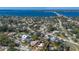 Overhead view of a charming home and neighborhood with a lovely blue ocean backdrop at 610 Casabella Dr, Bradenton, FL 34209