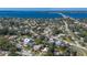 Expansive aerial shot of a charming neighborhood near a beautiful blue ocean at 610 Casabella Dr, Bradenton, FL 34209