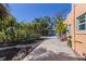 Wide driveway leading to a well-maintained home exterior with beautiful landscaping and a tranquil atmosphere at 610 Casabella Dr, Bradenton, FL 34209