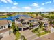 Stunning lakefront home with a two-car garage and solar panels, set against a beautiful water backdrop at 6326 Brevada Ln, Apollo Beach, FL 33572