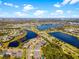 Aerial view of a lakeside neighborhood highlighting a home's location with easy access to the water at 6326 Brevada Ln, Apollo Beach, FL 33572