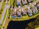 Aerial view outlines a private backyard with a pool in a lakeside property with verdant surroundings at 6326 Brevada Ln, Apollo Beach, FL 33572