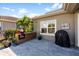 Outdoor kitchen and patio area with a built-in grill, perfect for outdoor entertaining and dining at 6326 Brevada Ln, Apollo Beach, FL 33572