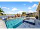 Sparkling pool and spa overlooking a picturesque lake creating a luxurious outdoor oasis for relaxation and enjoyment at 6326 Brevada Ln, Apollo Beach, FL 33572