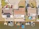 Aerial view of a waterfront community with boat docks at 6518 Leeside Isle, Hudson, FL 34667