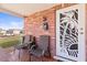 Cozy front porch with seating and a decorative door, perfect for relaxing at 6518 Leeside Isle, Hudson, FL 34667