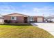 Charming brick home with a well-maintained lawn and inviting curb appeal at 6518 Leeside Isle, Hudson, FL 34667