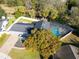 An overhead shot of the home showcasing the pool and mature trees at 7115 Edenwood Pl, Tampa, FL 33615