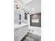 Stylish bathroom featuring a vanity sink with modern fixtures and gray tiled shower at 7115 Edenwood Pl, Tampa, FL 33615