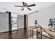 Bedroom with dark wood floors, gray closet doors and faux ivy backdrop at 7115 Edenwood Pl, Tampa, FL 33615