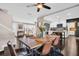 Dining room with table set and views into the living room and kitchen at 7115 Edenwood Pl, Tampa, FL 33615