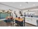 Bright kitchen featuring a butcher block island, white cabinets, stainless steel appliances, and barstool seating at 7115 Edenwood Pl, Tampa, FL 33615